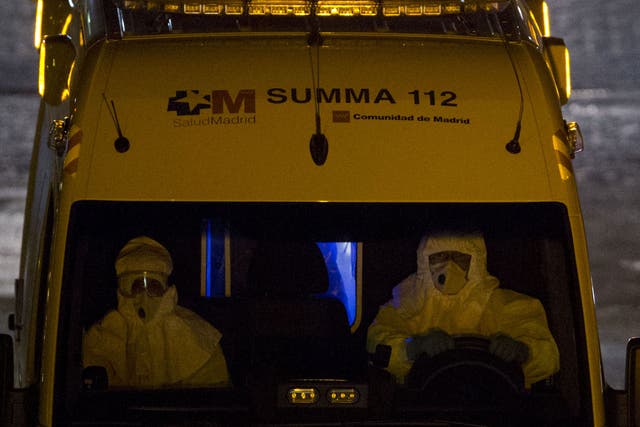 The Spanish nurse infected by Ebola is moved by ambulance in Alcorcon, Spain