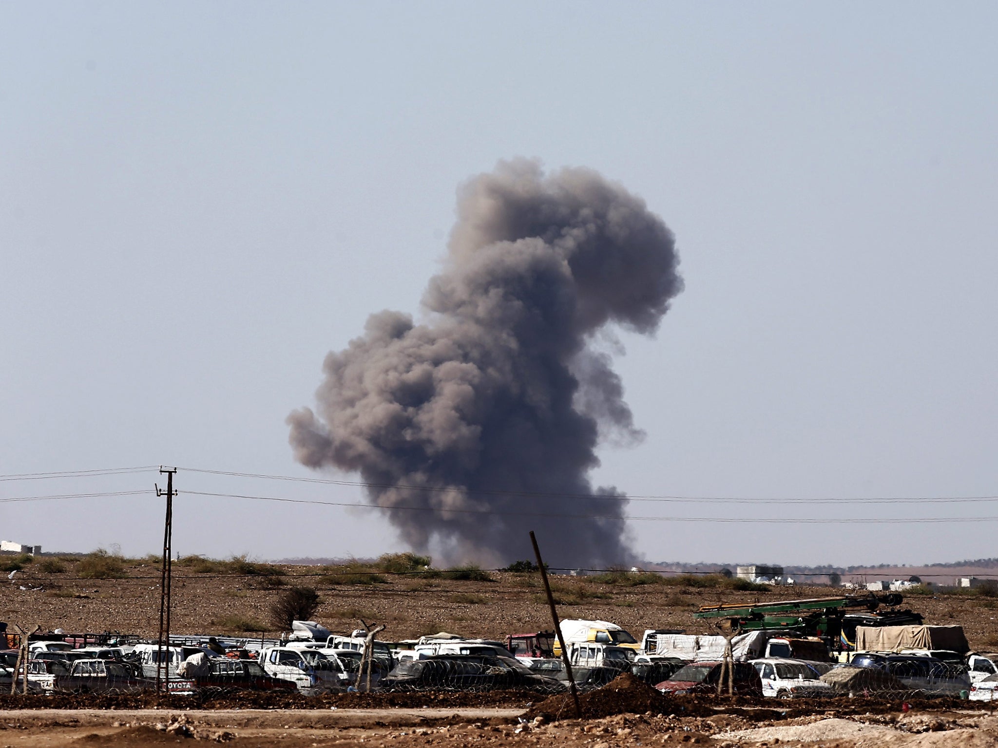 Smoke rises after an air strike by allied forces against Isis targets in the west of Kobani