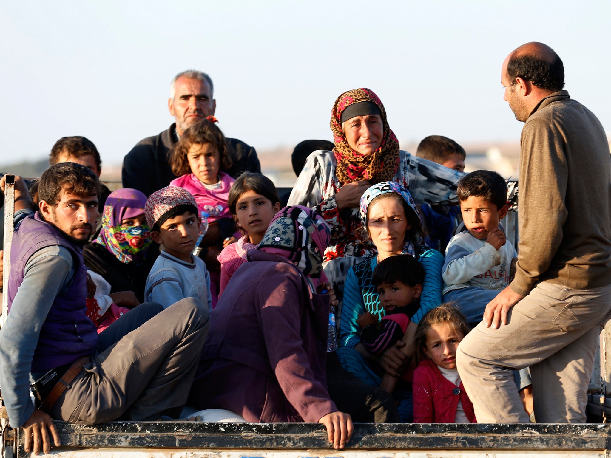 Syrian Kurdish refugees after crossing into Turkey from Kobani
