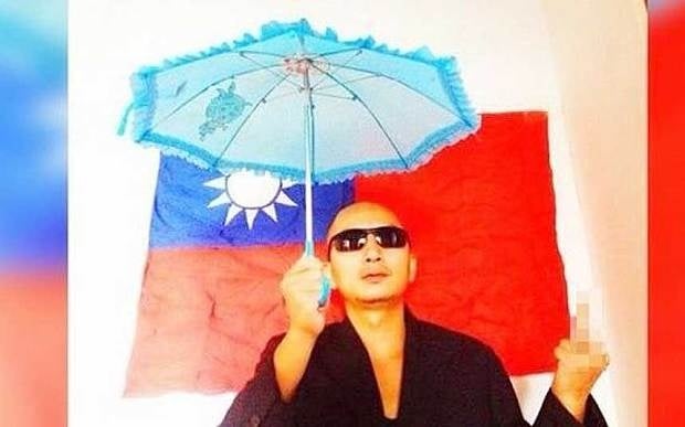 Wang Zang tweeted this picture of himself in front of the flag of the Republic of China