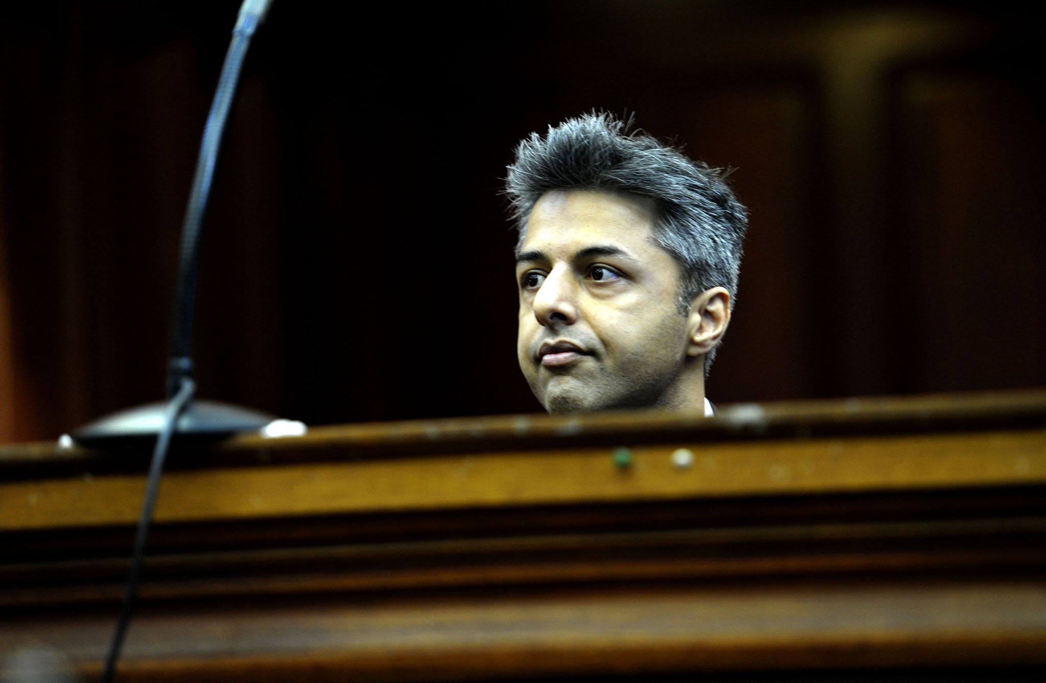 Shrien Dewani broke down in tears as graphic footage and images of his wife's dead body were shown in a South African court