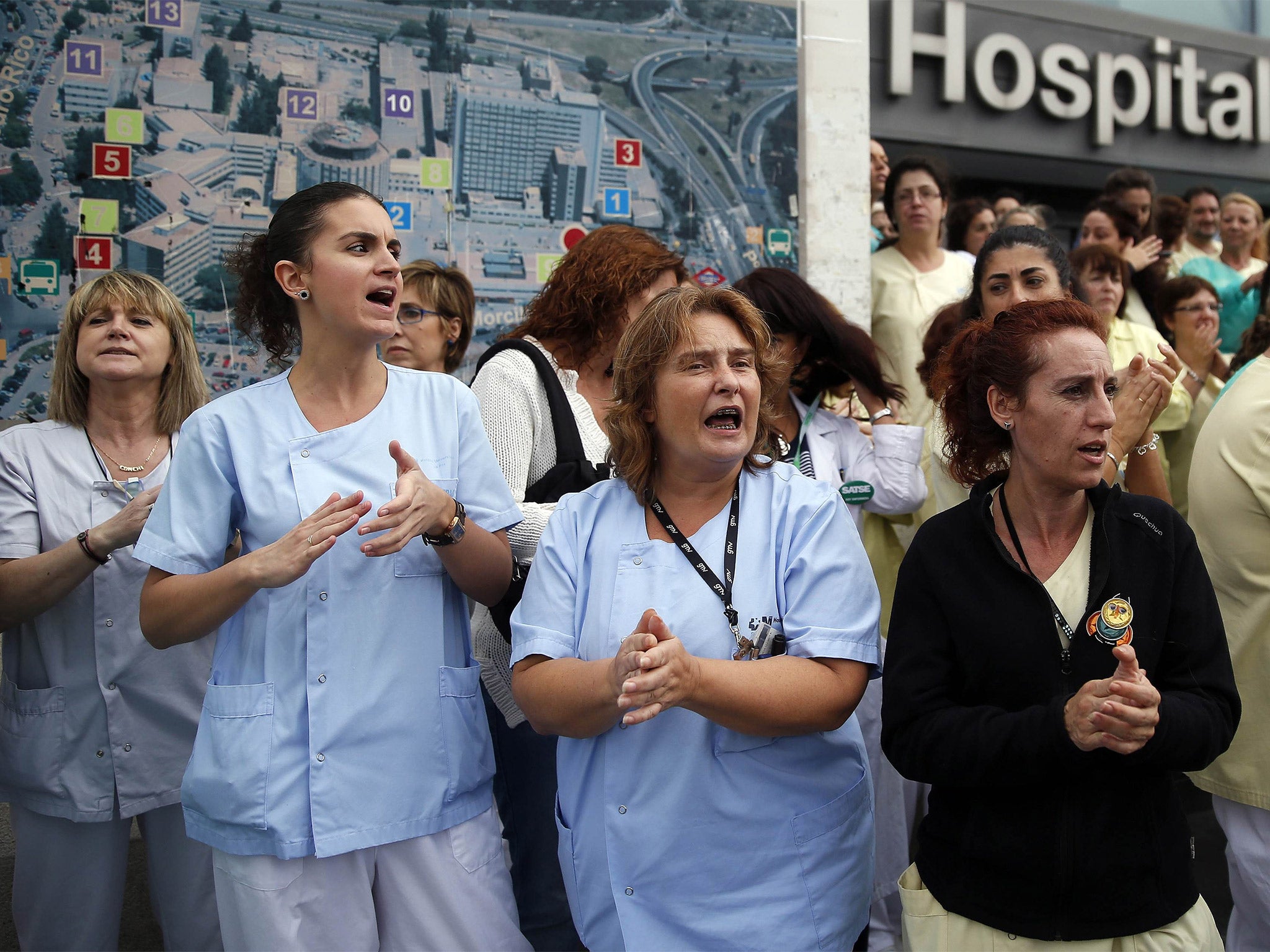 Health workers protest outside La Paz Hospital calling for Spain's Health Minister Ana Mato to resign