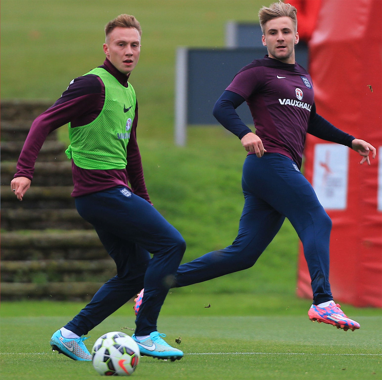 Luke Shaw, right, training at St George's Park