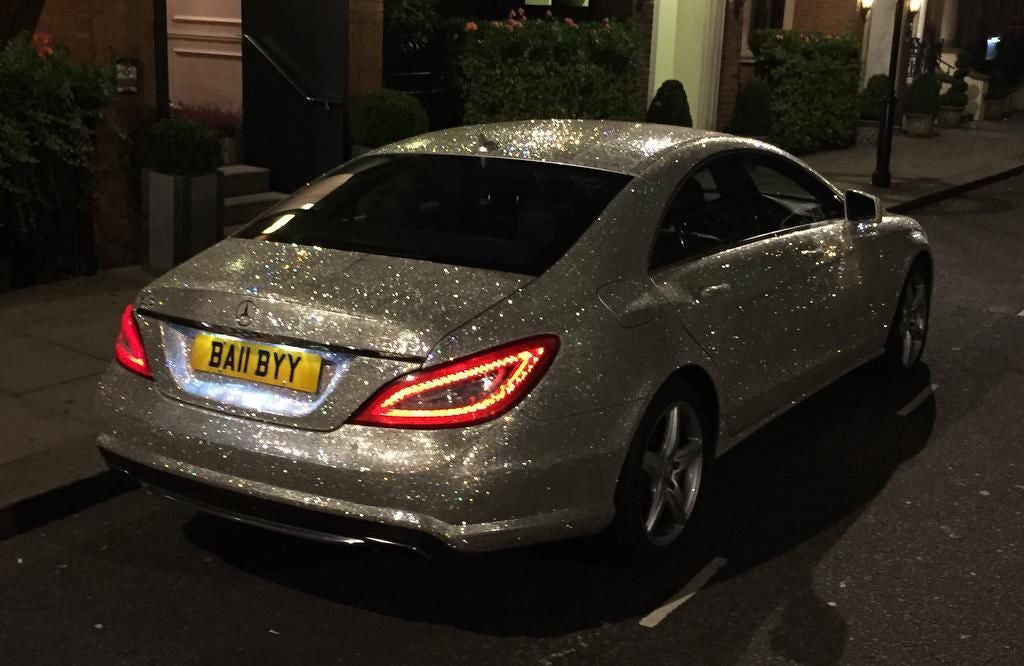 A millionaire student is selling her Swarovski-encrusted Mercedes to raise money for two animal charities