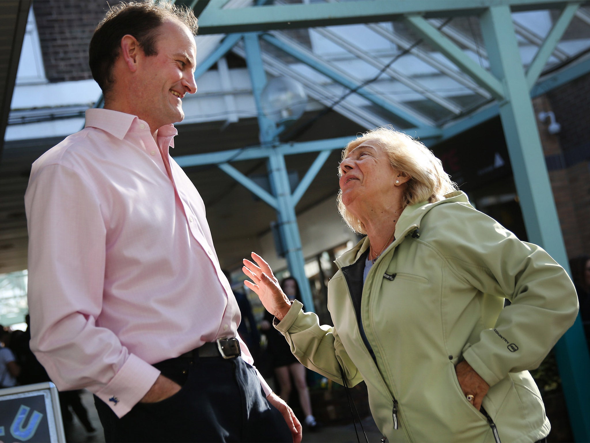 UKIP’s Douglas Carswell talks to supporter Asma Jackson as he canvasses for votes in Frinton-on-Sea