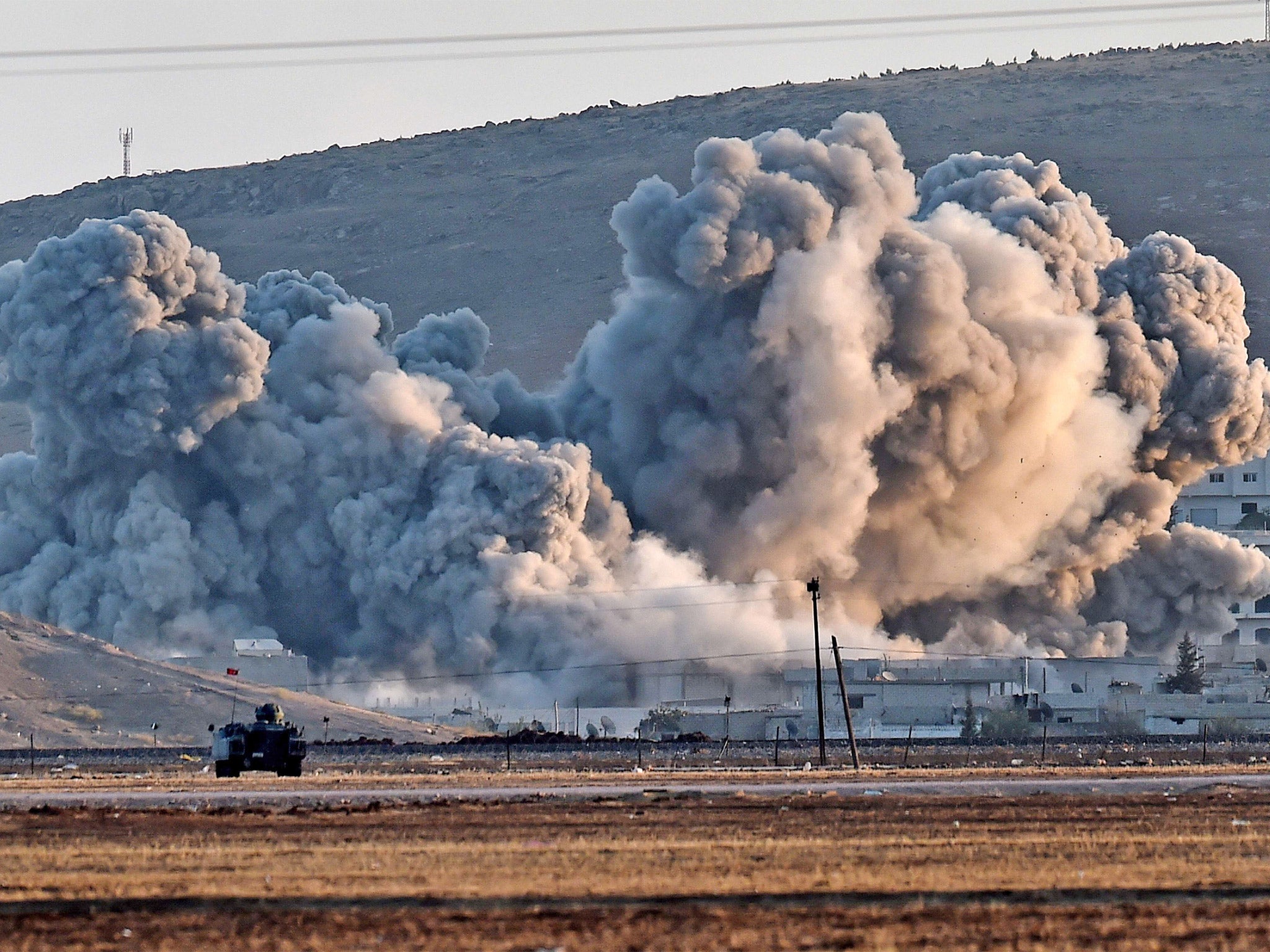 Smoke from air strikes against Isis in Kobani can be seen from across the border in Mursitpinar, Turkey  