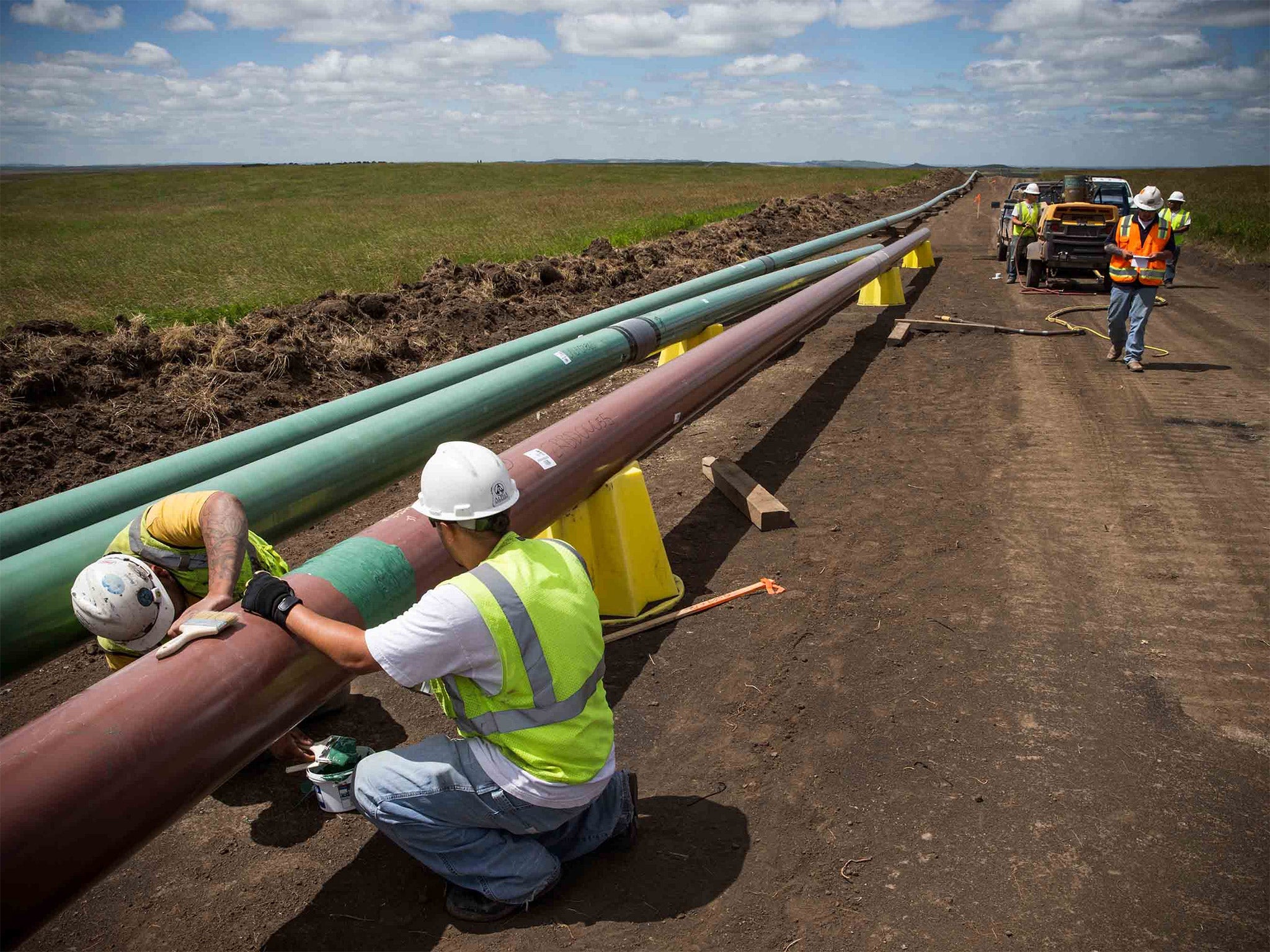 Laying a pipeline in North Dakota. Shale oil has seen US production soar and imports slump