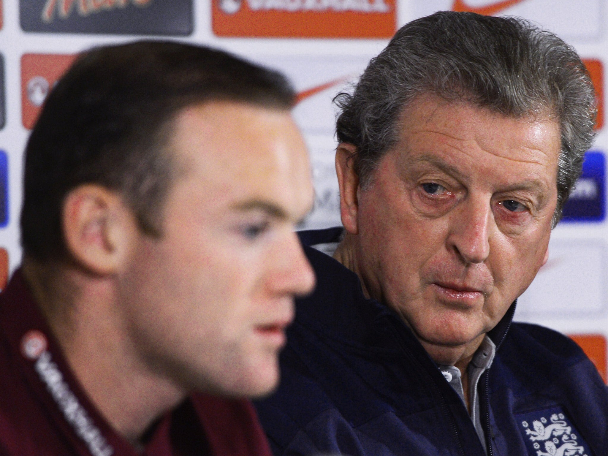 Roy Hodgson (right) listens as Wayne Rooney answers a question during an England press conference