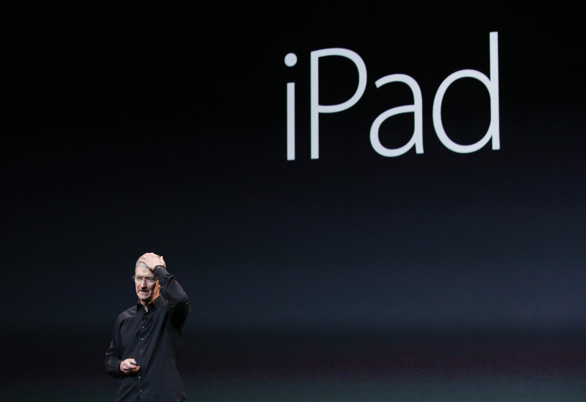 Apple Inc CEO Tim Cook, seen here introducing an iPad on 22 October 2013, is expected to unveil the firm's latest iPad offerings
