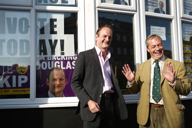 Douglas Carswell stands with Nigel Farage on October 9, 2014 in Clacton-on-Sea, England. 