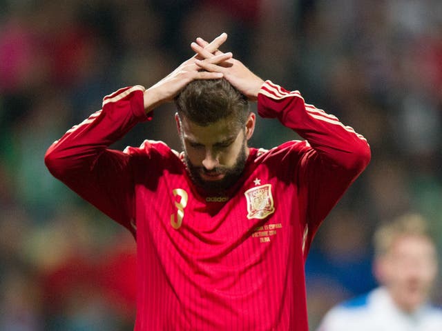 Spain's Gerard Pique reacts after Euro 2016 qualifing football match between Slovakia and Spain