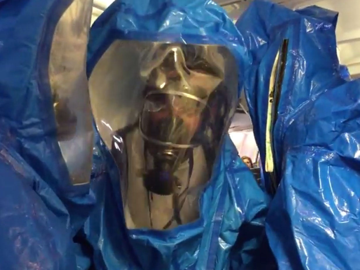Medical teams dressed in protective suits boarded the aircraft