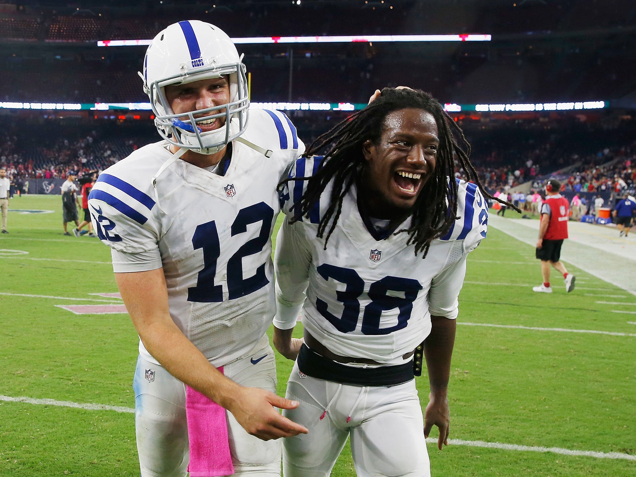 Andrew Luck and Sergio Brown celebrate the Indianapolis Colts' victory over the Houston Texans