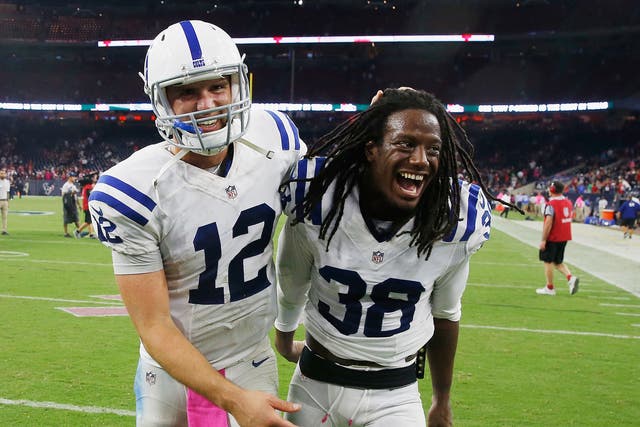 Andrew Luck and Sergio Brown celebrate the Indianapolis Colts' victory over the Houston Texans