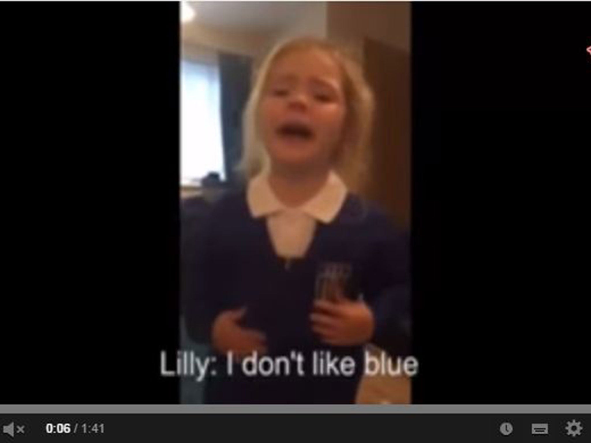 Lilly, a three-year-old Manchester United fan, cries at the sight of her new school uniform