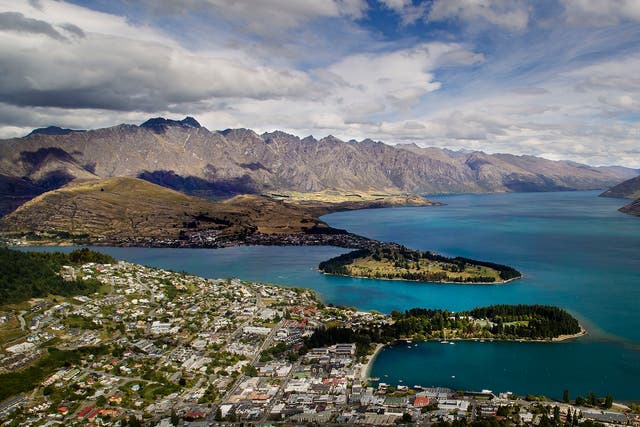 The city of Queenstown on the shores of Lake Wakatipu with the Remarkables mountain range in the background.   
