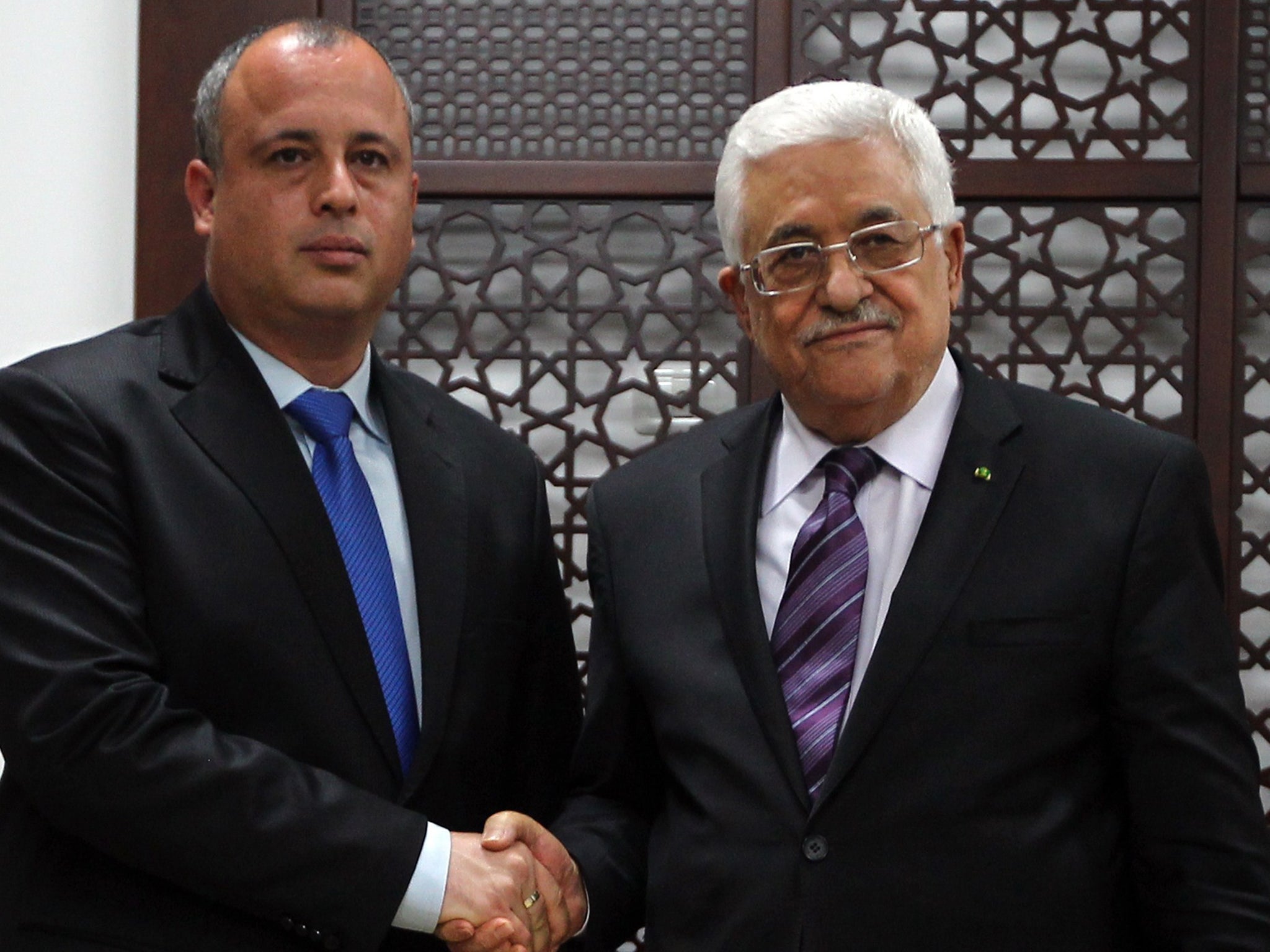 Israeli MP Hilik Bar (left), with Palestinian President Mahmoud Abbas in April, is urging Labour MPs to defy the whip