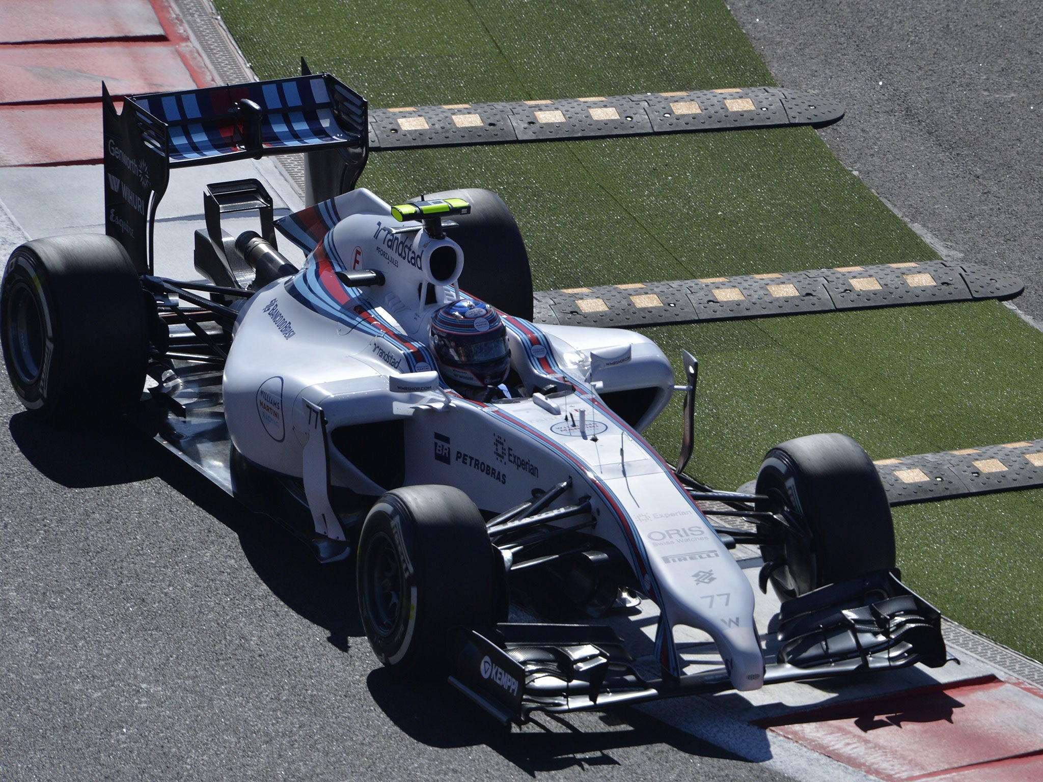 Valtteri Bottas negotiates the newly-installed speed bumps at turn two