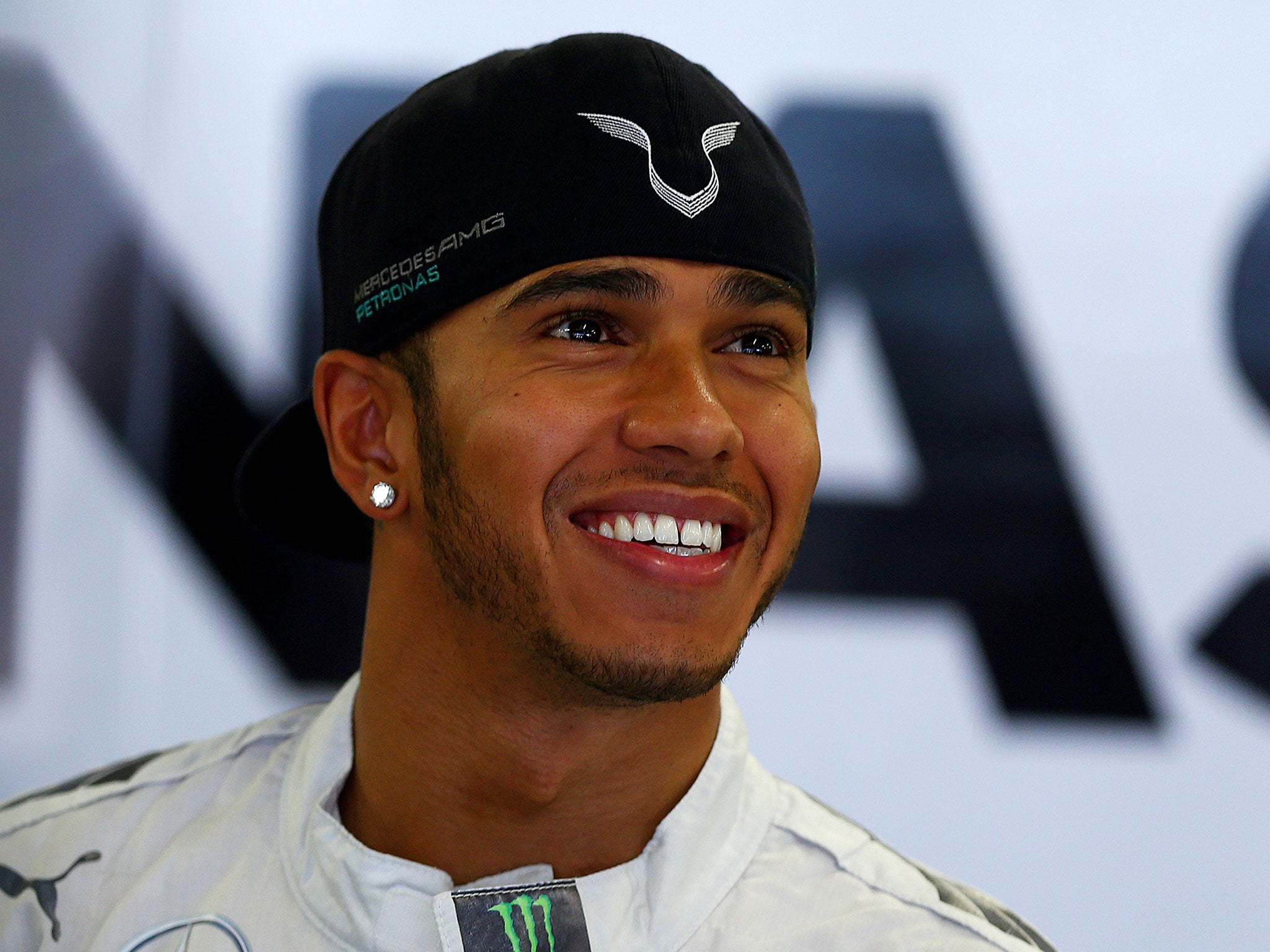 Lewis Hamilton smiles in the pit lane at Sochi