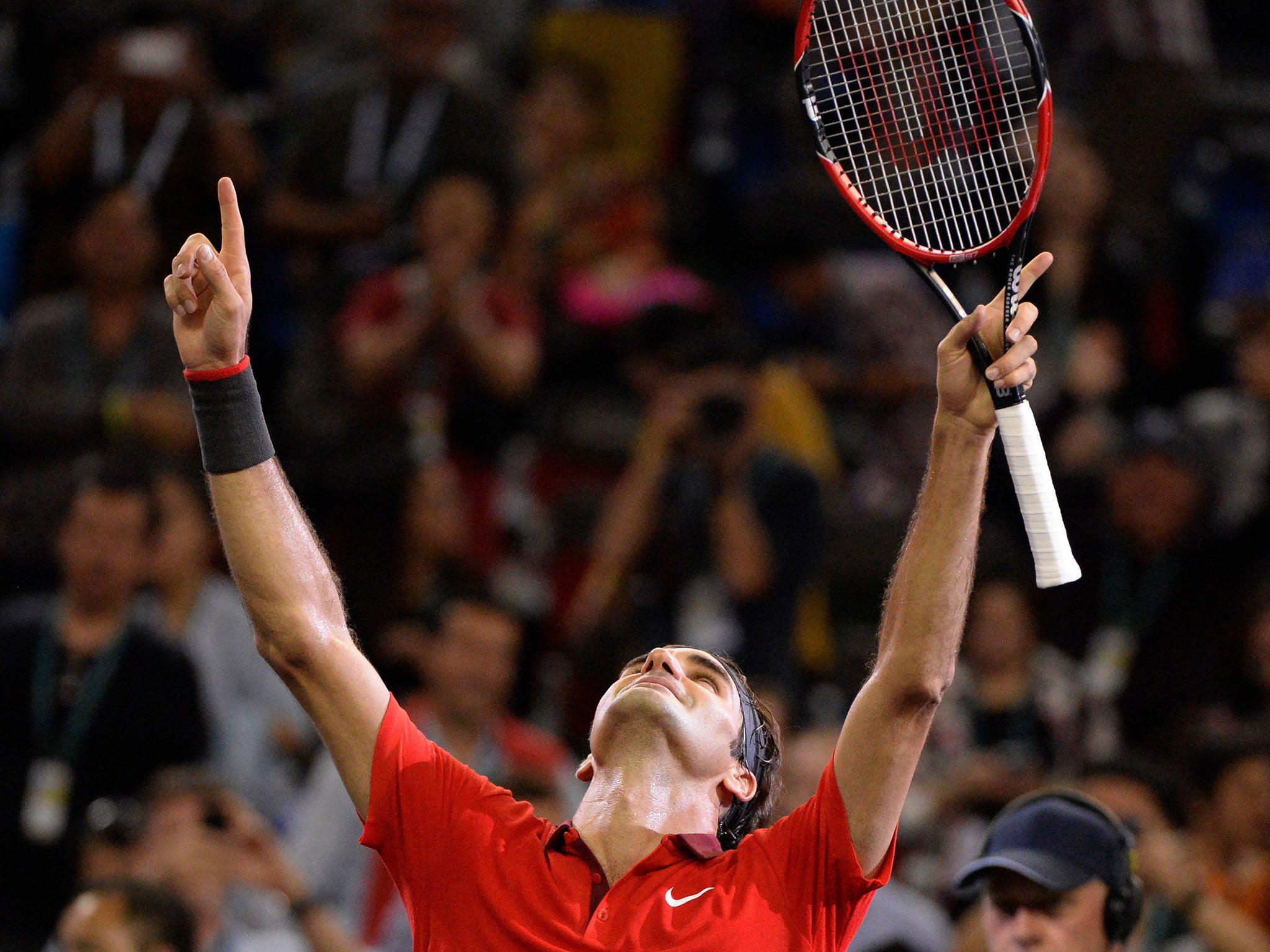 Roger Federer celebrates after winning the Shanghai Masters