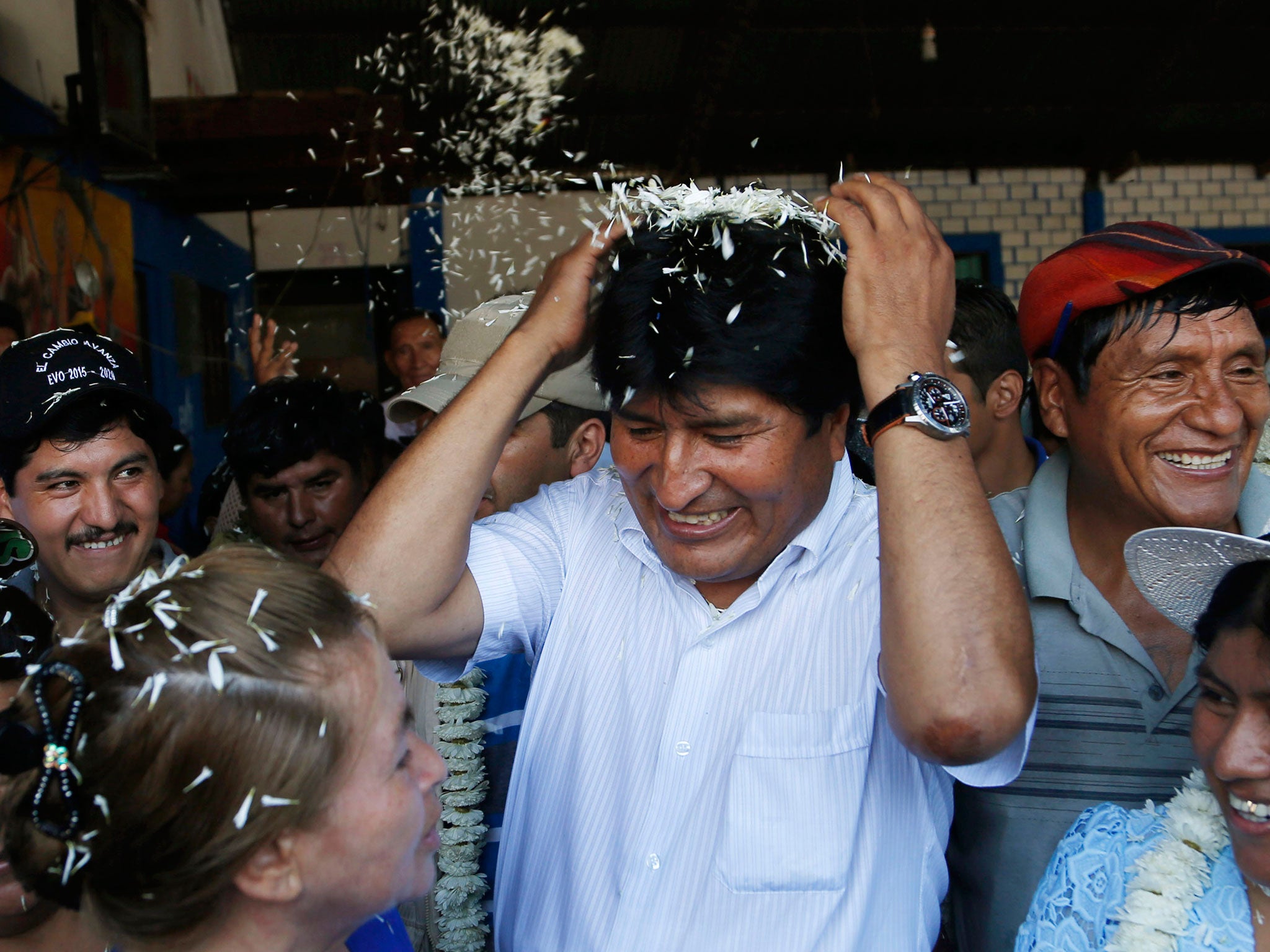 Bolivia's President Evo Morales in greeted by supporters upon his arrival to vote at a polling station