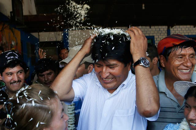 Bolivia's President Evo Morales in greeted by supporters upon his arrival to vote at a polling station