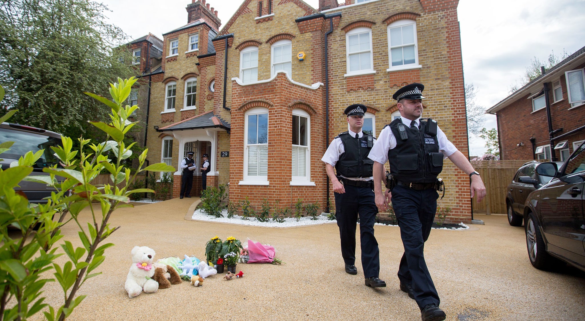 Police leave the New Malden home in April this year
