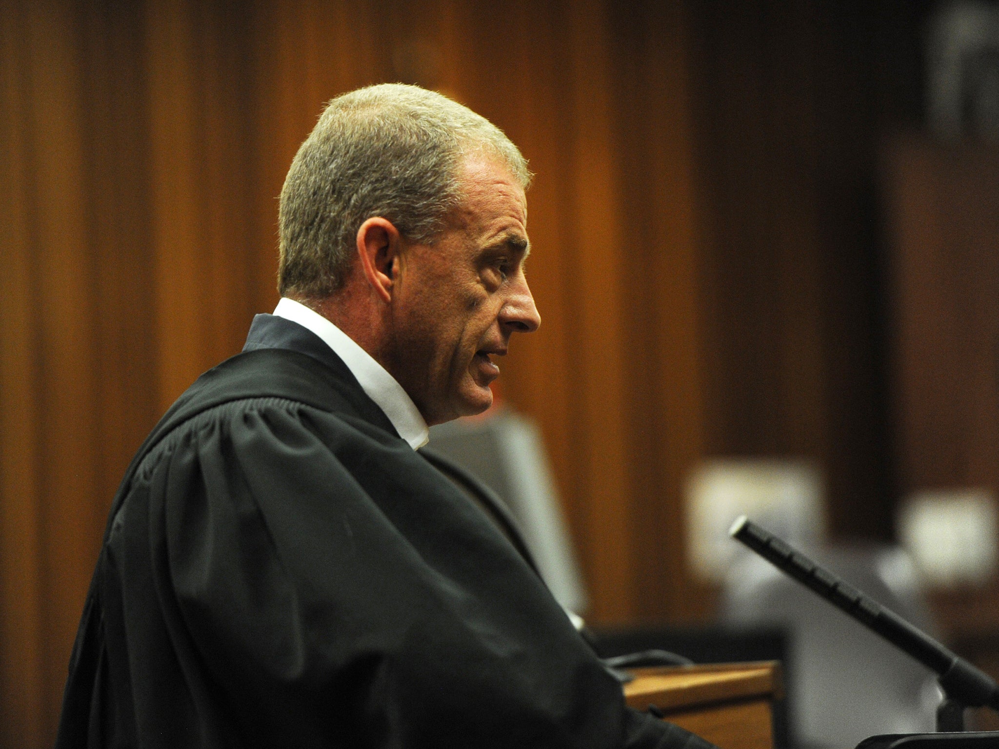 Prosecutor Gerrie Nel cross-examines a witness during the court appearance of Oscar Pistorius in his sentencing on a charge of culpable homicide at the High Court in Pretoria (Reuters)