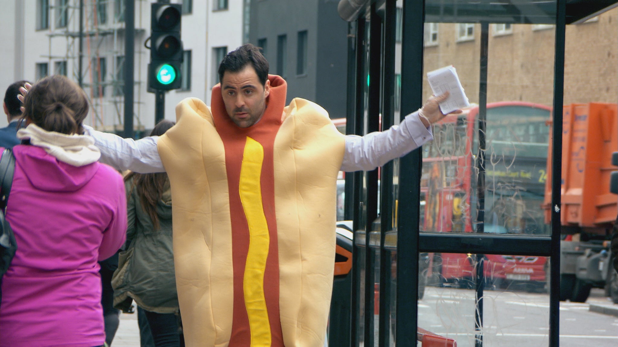 Daniel Waving in a Hotdog Suit in the first episode of The Apprentice 2014