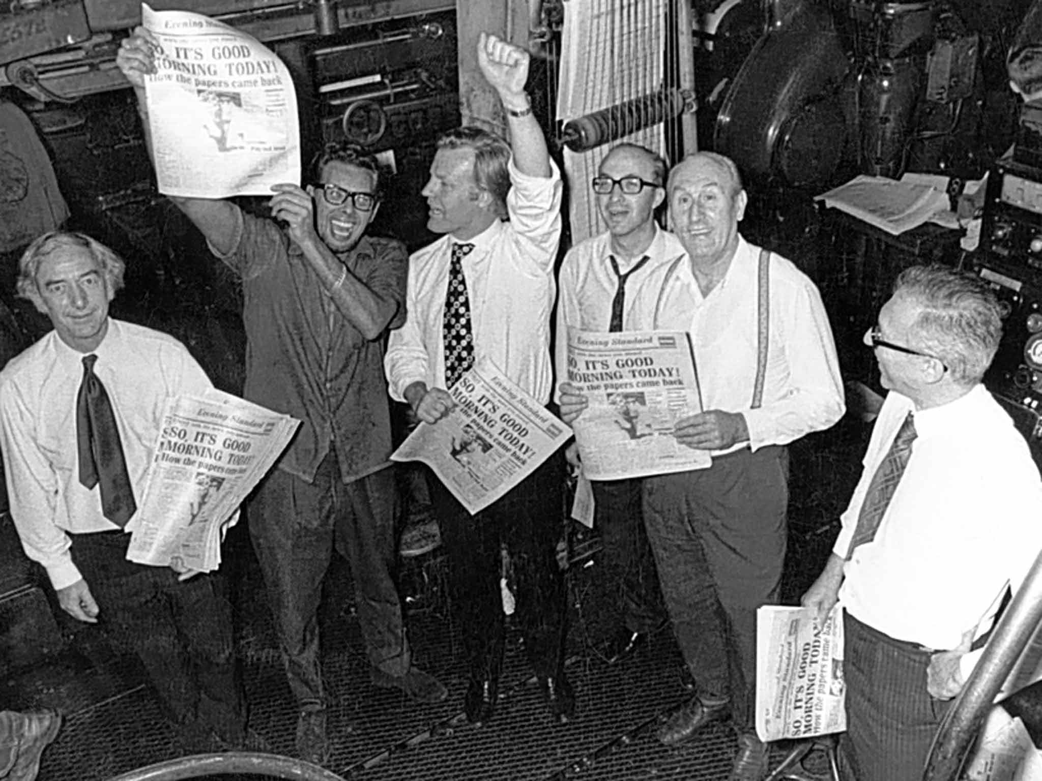 Stevens, with arm raised, and 'Daily Express' colleagues at the end of a print strike in 1971