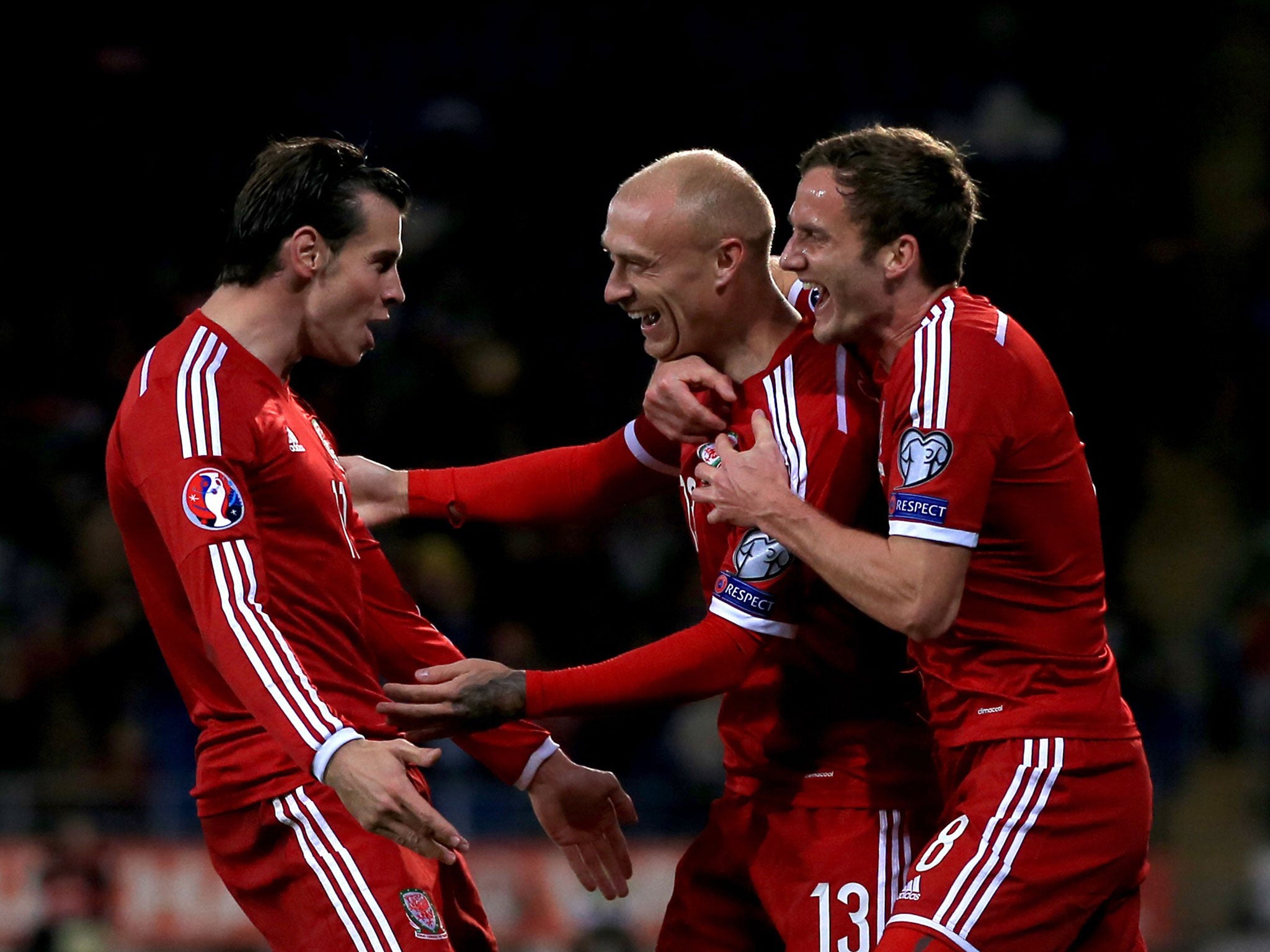 David Cotterill celebrates his goal with Gareth Bale (left) and Andy King (right)