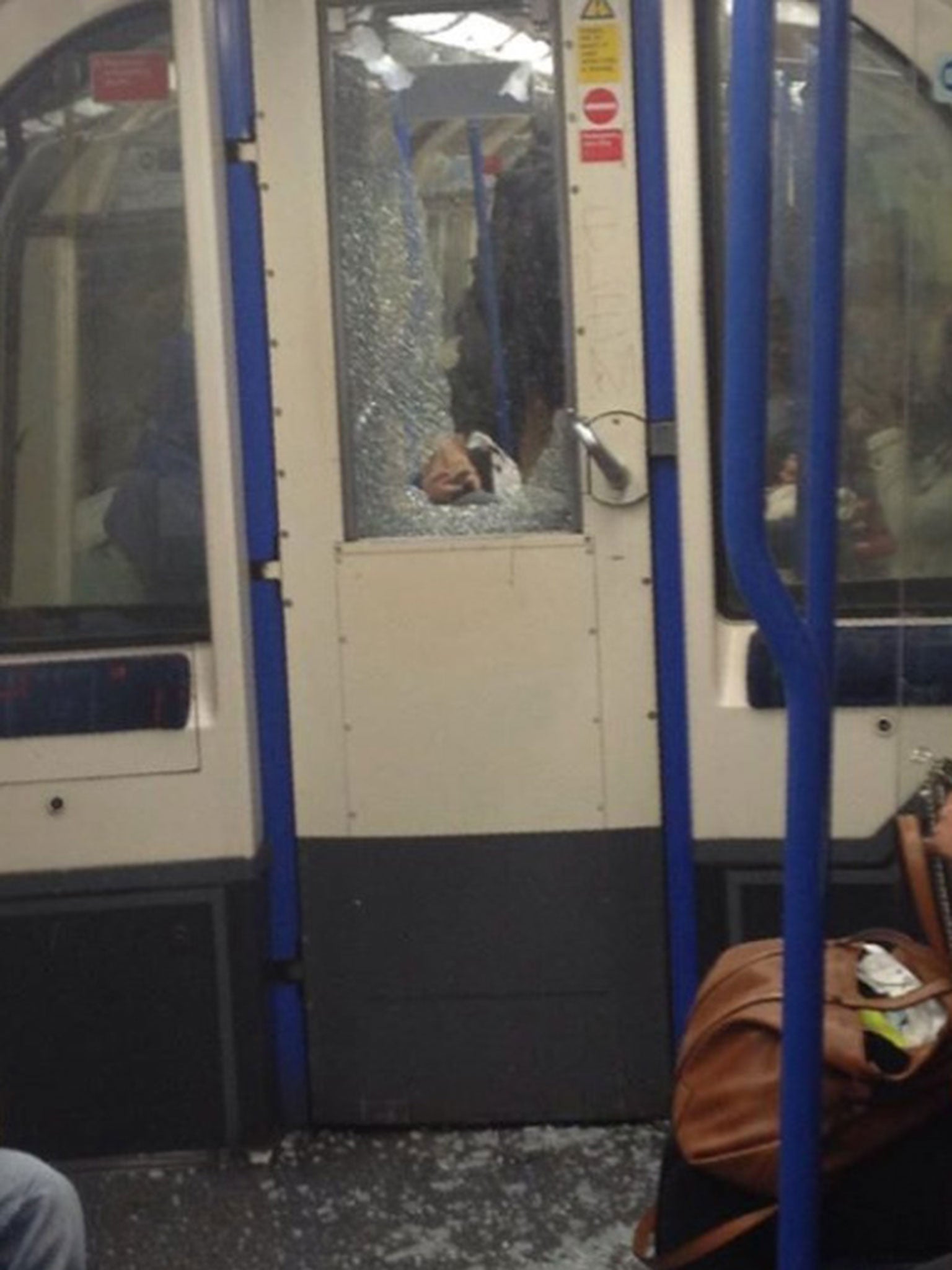Passenger Sarah Whiteman took a picture of the window, in a door between carriages, showing it broken and shattered