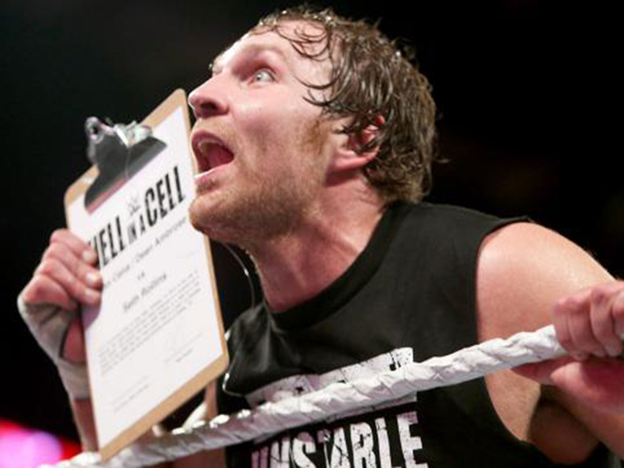 Dean Ambrose grabs the contract to face Seth Rollins at Hell in a Cell
