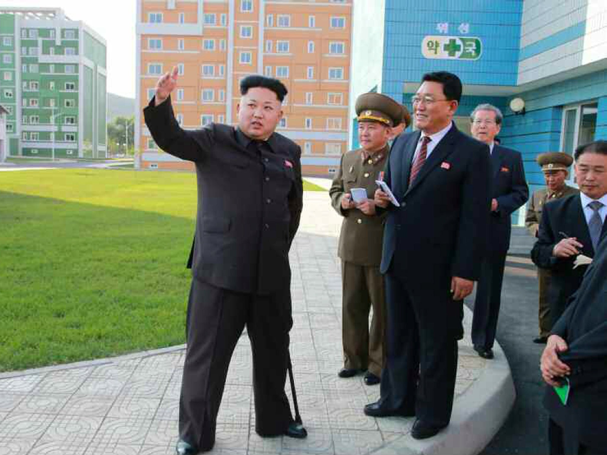 North Korean leader Kim Jong-Un during an inspection tour of a newly-built housing complex in Pyongyang on October 14, 2014