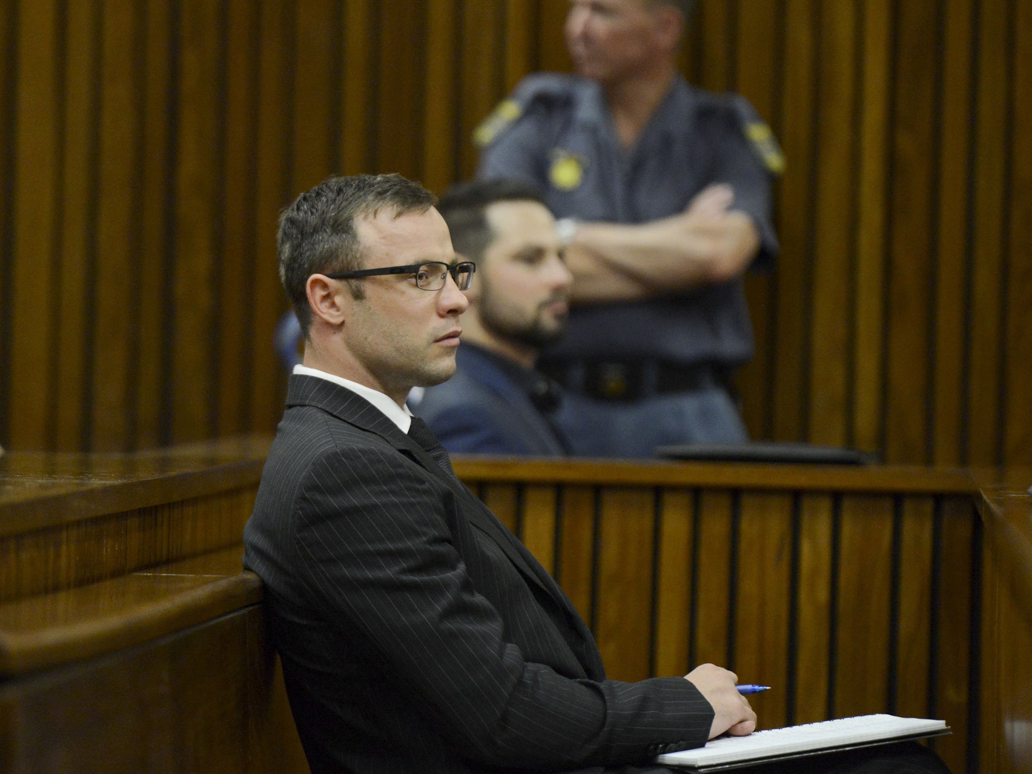 Oscar Pistorius sits in the Pretoria High Court on the second day of his sentencing 