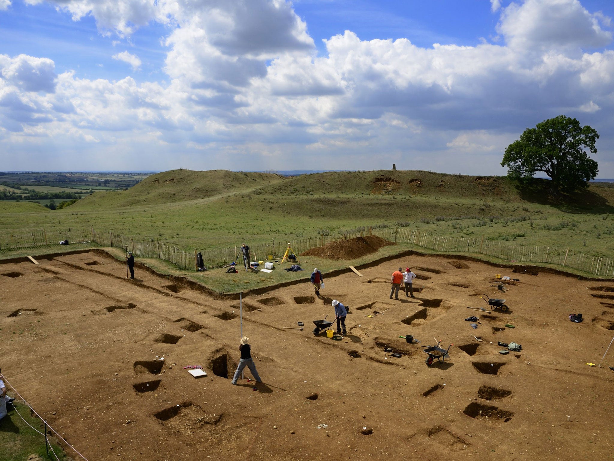 An ancient Celtic roundhouse under excavation in front of the hill fort at Burrough Hill (University of Leicester/Aerial-Cam)