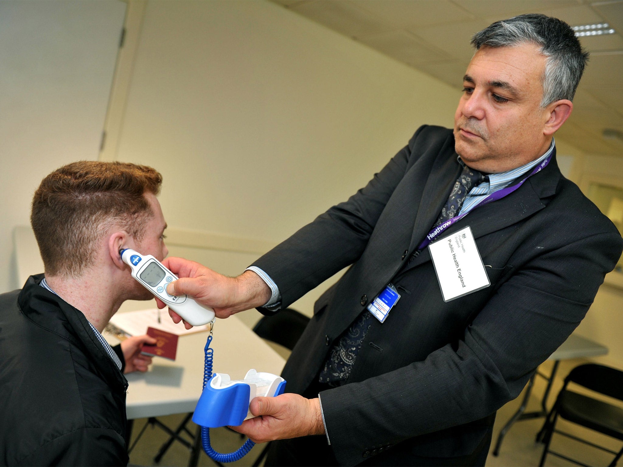 A passenger is screened at Heathrow, as enhanced measures for Ebola began at Britain's biggest airport