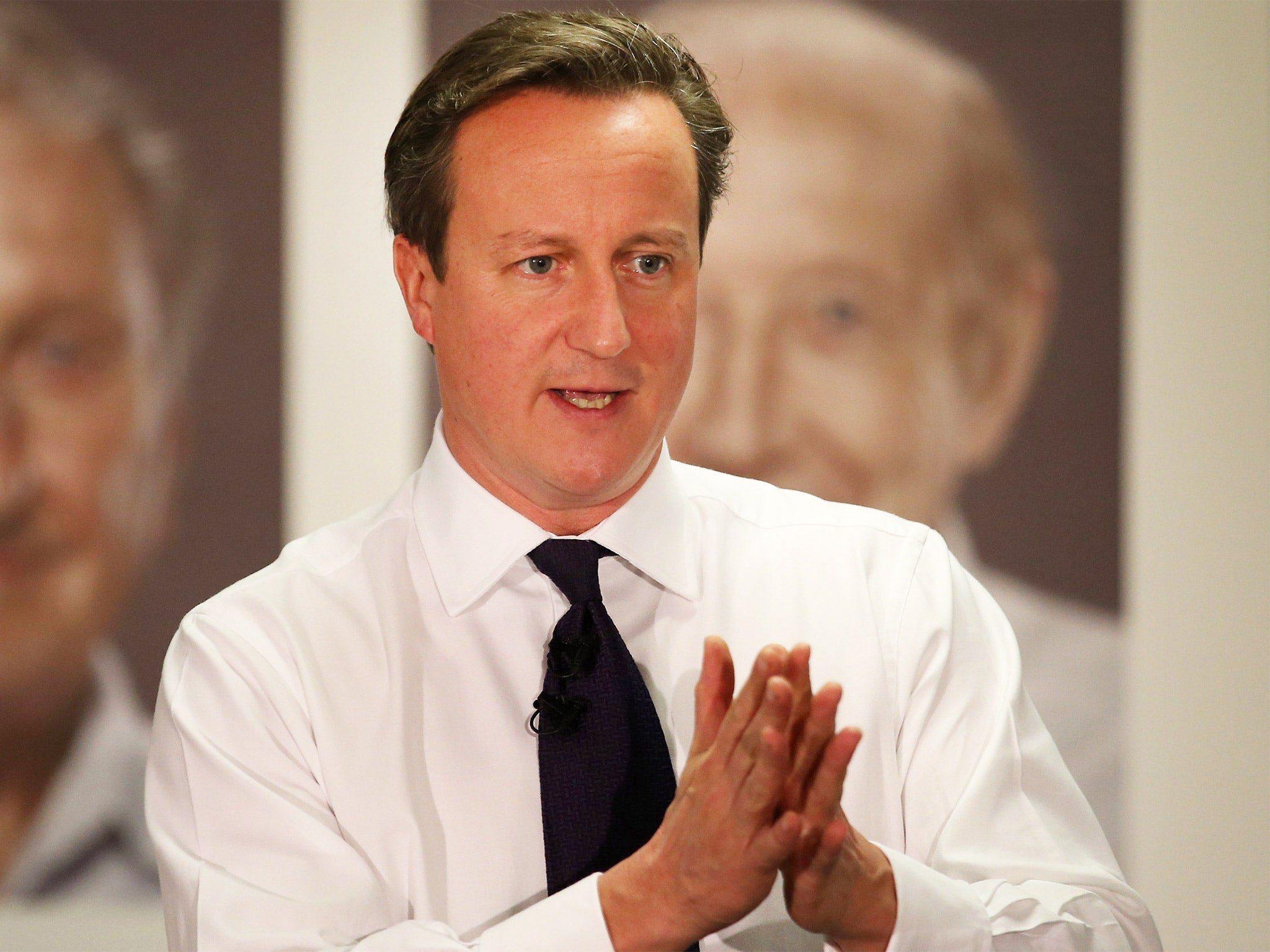 Cameron vows to 'confront the menace of extremism' in UK charity sector