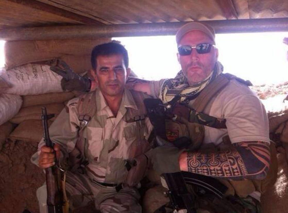 A man named as Ron pictured with a Kurdish fighter in Iraq 