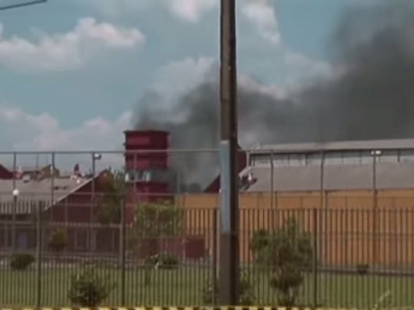 Fire smoke billowing out of the prison that houses 172,000 inmates