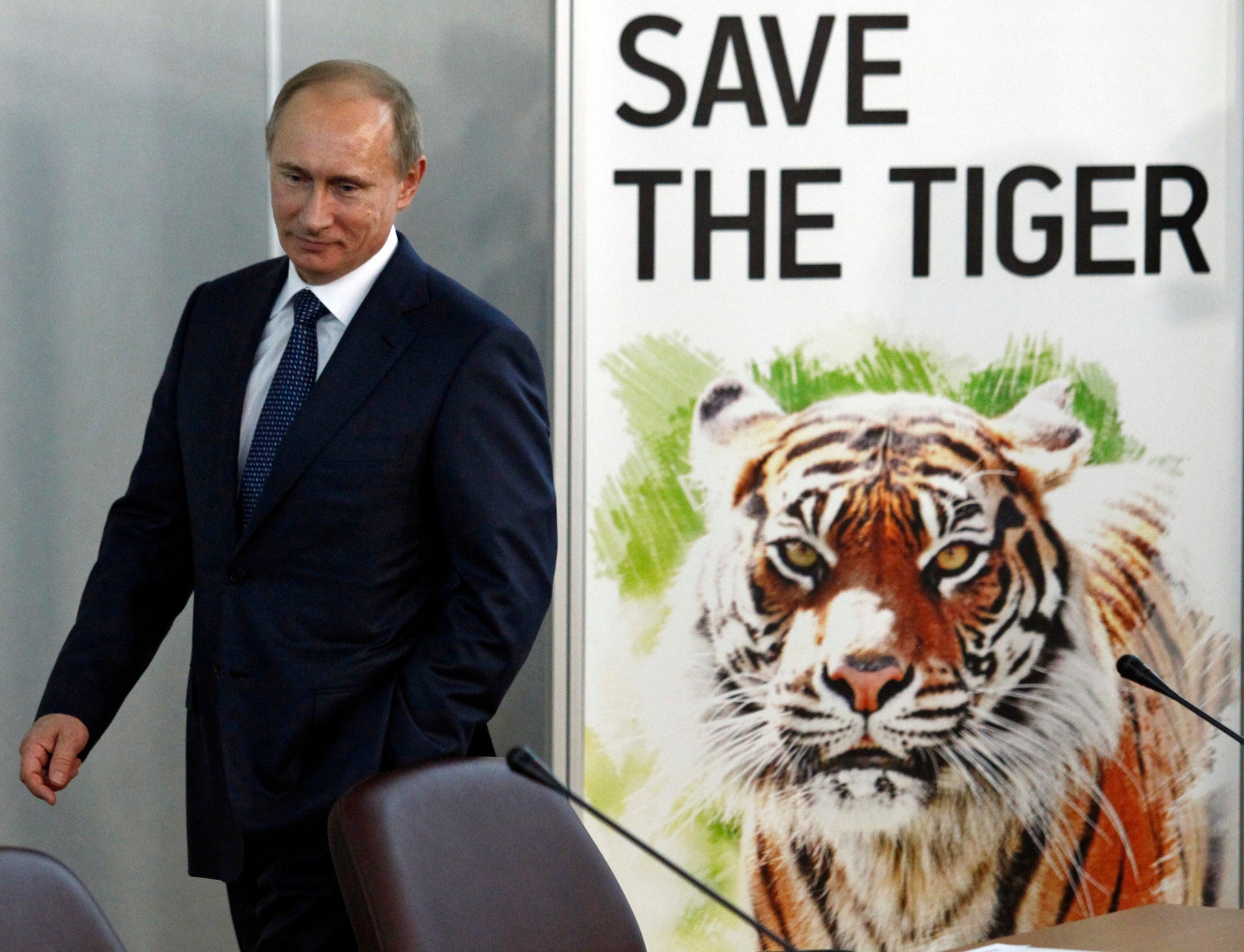 Putin, here at the International Tiger Forum in St Petersburg, Russia, in 2010, released three Siberian tigers into the wild in May 2014