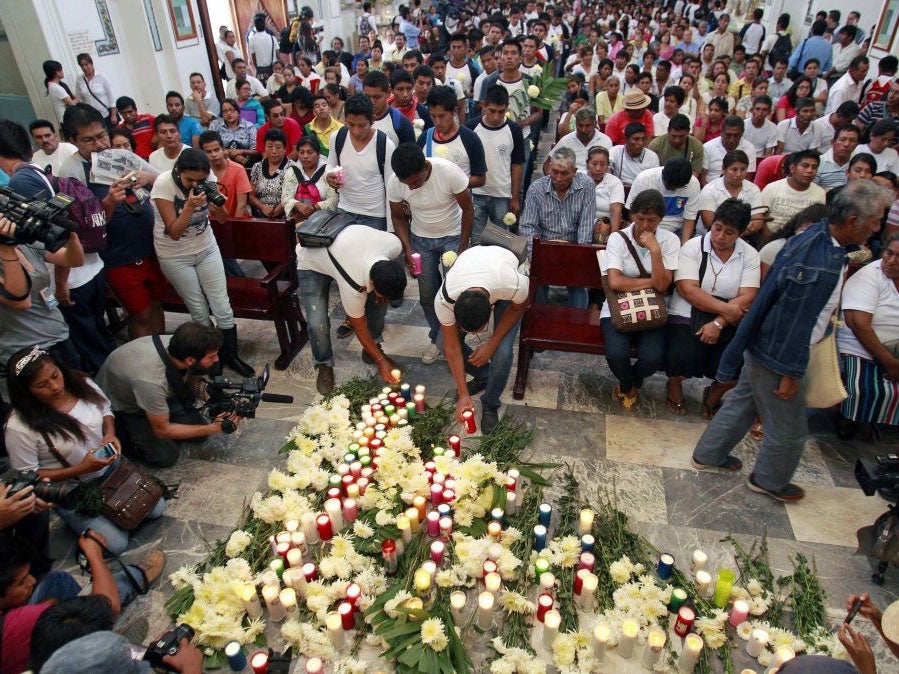 Relatives of 43 missing students participate in a Mass in Chilpancingo, Guerrero state, Mexico, 14 October