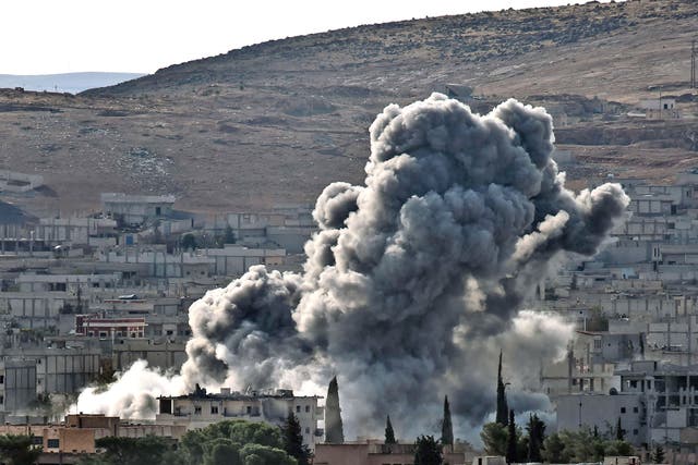 Smoke rises from the Syrian town of Kobani