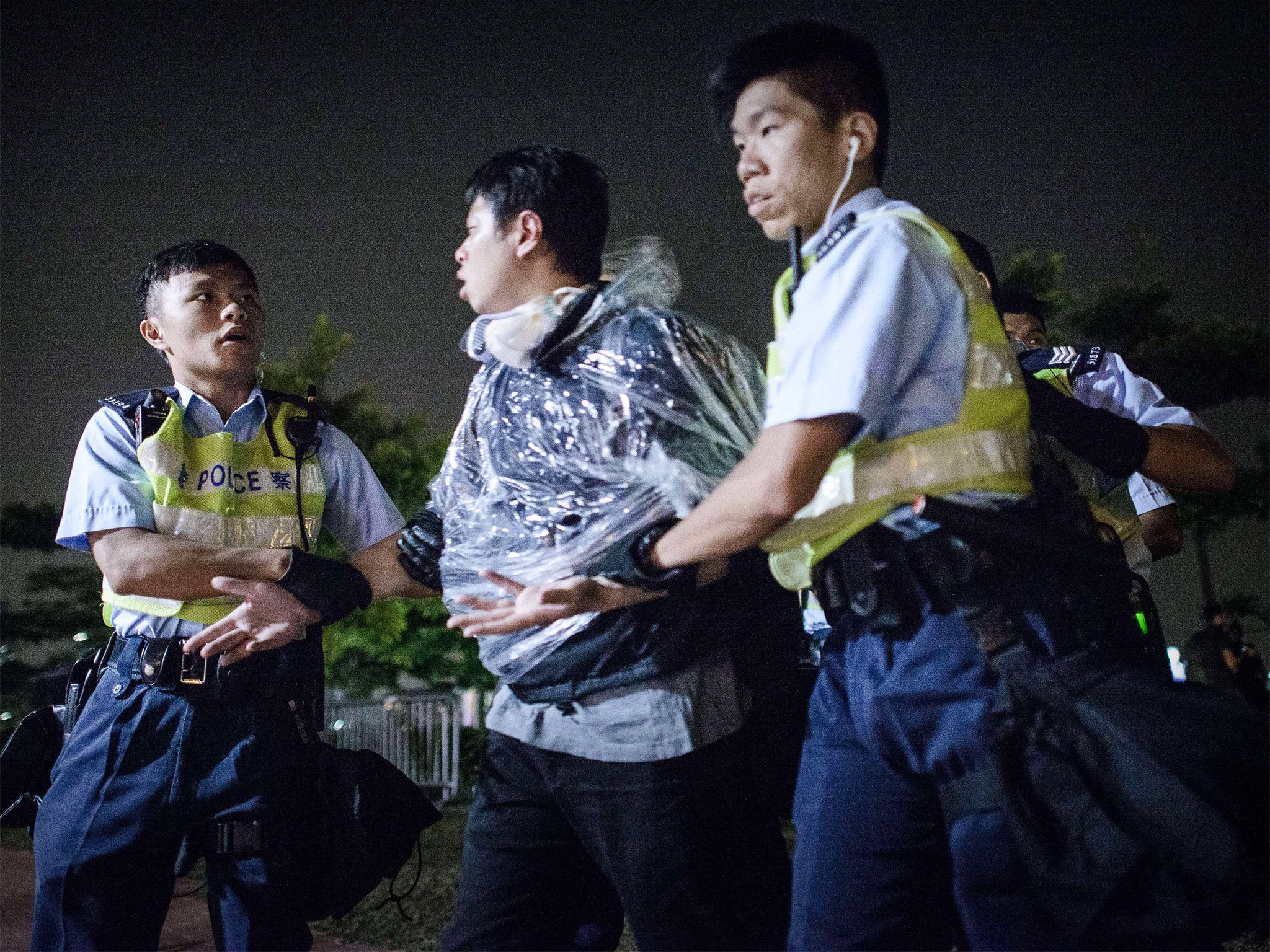 A protester being arrested outside the central government offices in Hong Kong on Wednesday (Getty)