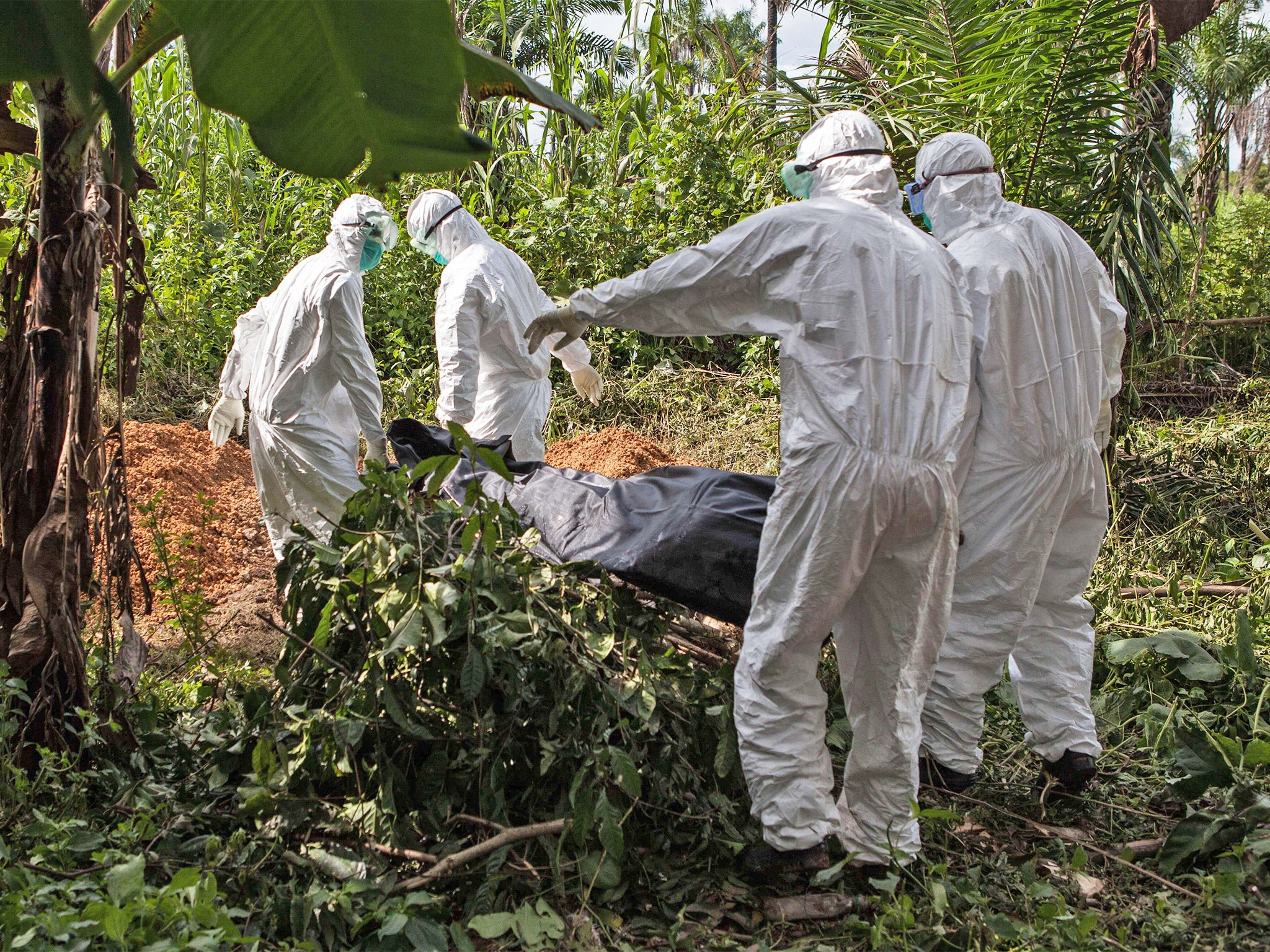 A matter of life and death: an Ebola victim is buried (Getty)