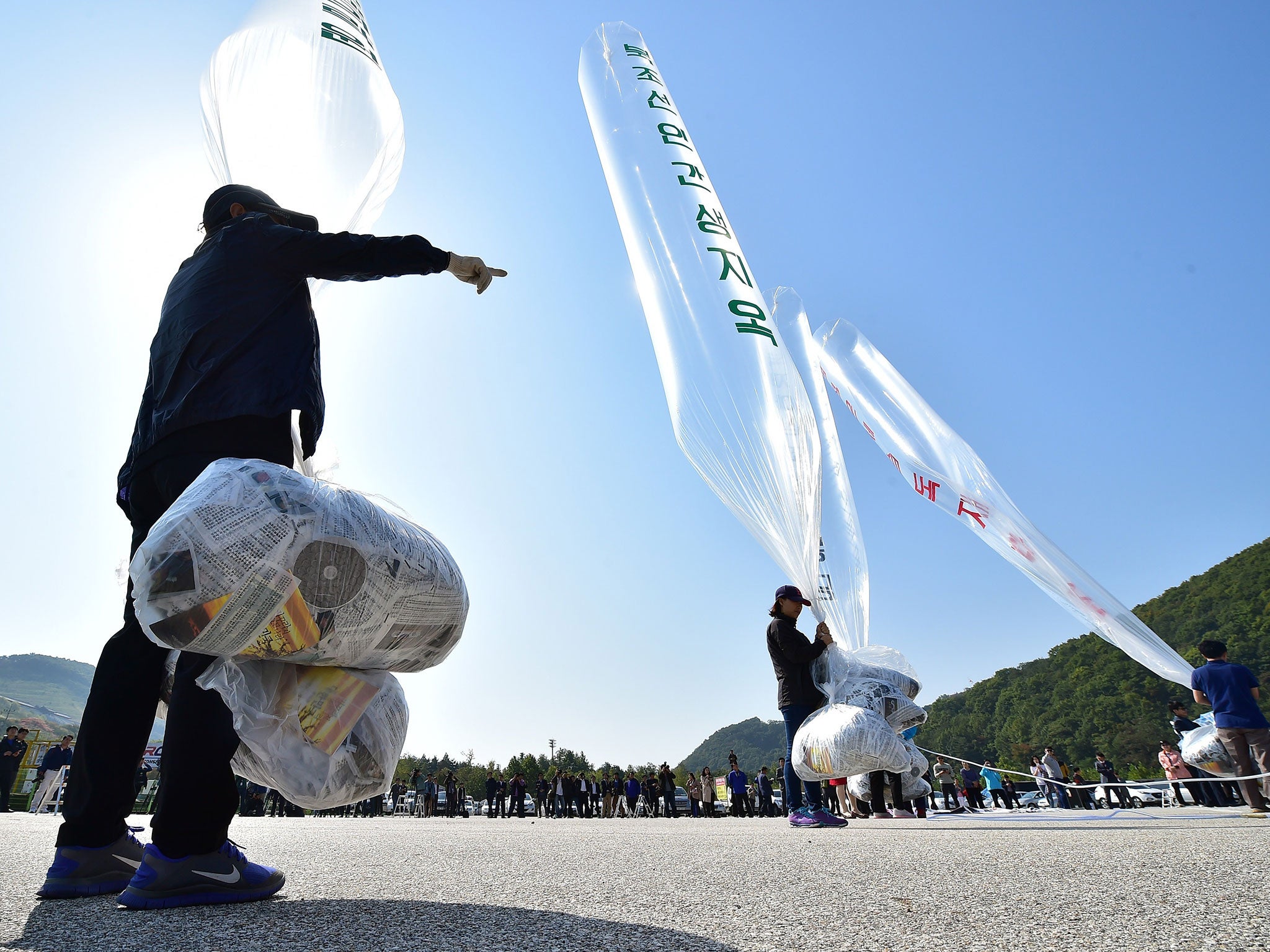 South Korean activists prepare to release balloons carrying anti-North Korea leaflets at a park near the inter-Korea border in Paju, north of Seoul