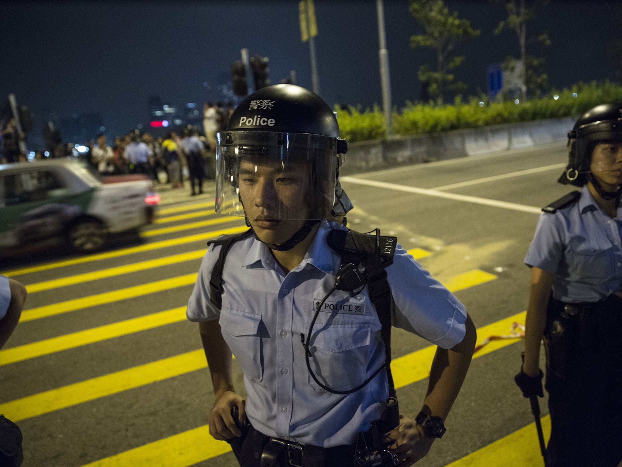 Police block roads to stop protesters as scuffles break out between police and protesters as tensions continue October 16, 2014 in Hong Kong, Hong Kong.