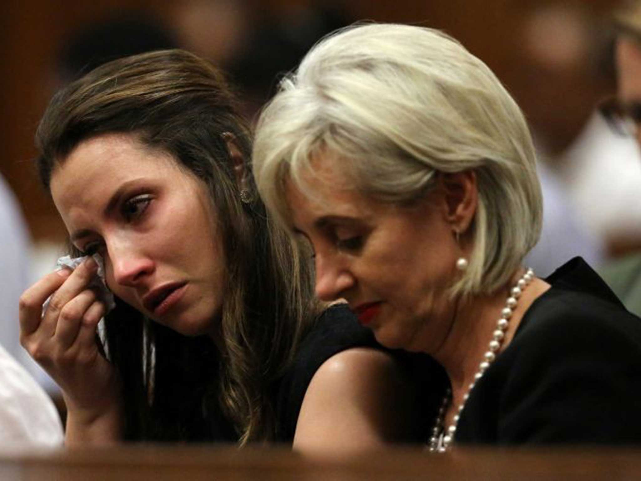 Aimee (L), sits next to her aunt Lois in court earlier today