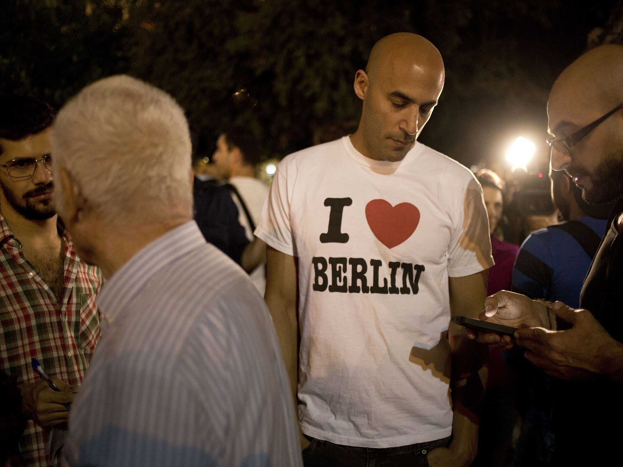 Israeli expats in Berlin attend a protest to encourage their compatriots to move to Germany