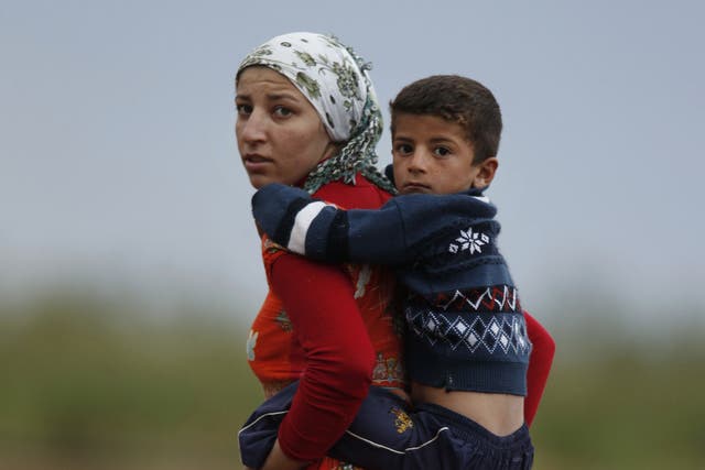 A Kurdish mother and son in the besieged town of Kobani